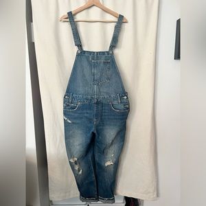 Levis Bib overalls. Medium Wash. distressed finish. Size M